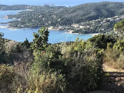 a view of a body of water from a hill at La Villa K, plage du Ruppione in Pietrosella