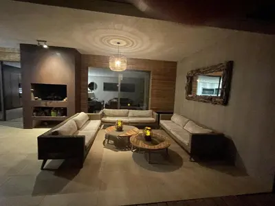 a living room with a couch and a coffee table at La Villa K, plage du Ruppione in Pietrosella
