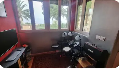 a room with a computer and a desk with windows at Spacieux T2 route des sanguinaires in Ajaccio
