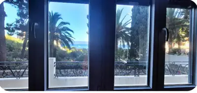 a view of the ocean from a window at Spacieux T2 route des sanguinaires in Ajaccio
