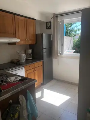 a small kitchen with a sink and a window at Villa A Nuciola - Prunete in Cervione