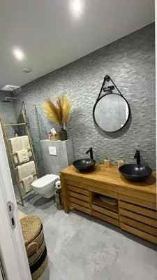 a bathroom with two sinks and a mirror on the wall at Baia Serena in Ajaccio