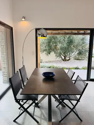 a dining room table with chairs and a bowl on it at Casa Caseddu, Heated pool, 4 people, Bonifacio in Bonifacio