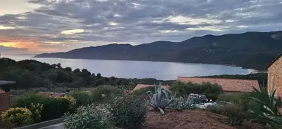 a view of a large body of water with mountains at Villa - 8 personnes - Soléa 3 - vue mer in Serra-di-Ferro