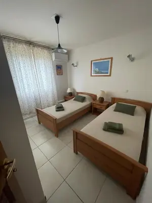 a room with two beds in a room at Casa di Piero e Anna in Porto-Vecchio