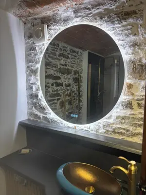 a bathroom with a sink and a mirror at Casa di a Volpe in Corte