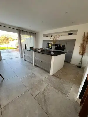 a large kitchen with a large tile floor at Maison de charme entre mer et nature 4pers in Cervione
