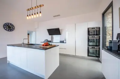 a villa with a swimming pool and a house at Panoramic Sea View - Heated Pool - Comfort in Coti-Chiavari