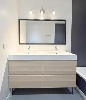 a bathroom with a sink and a large mirror at Panoramic Sea View - Heated Pool - Comfort in Coti-Chiavari