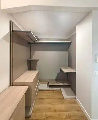 a walk in closet with empty shelves and wooden floors at Villa A Muredda, 6 pers, jacuzzi, 15 min plage en voiture in Porto-Vecchio