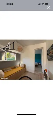 a room with a desk and a room with the ocean at A casa Patricia in Sari Solenzara