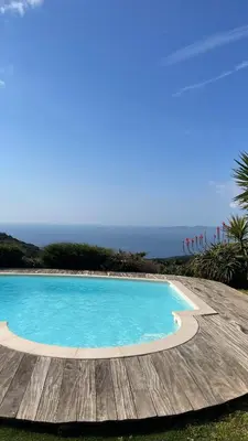 a large body of water with boats in it at Charmante Maison Vue mer Panoramique à Coti-Chiavari in Vaccili