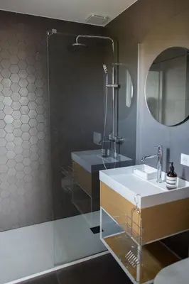 a bathroom with a sink and a shower at So Home in Porto-Vecchio