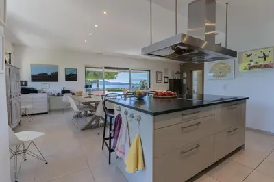 a kitchen with a large island with a counter top at Villa avec piscine privée in Serra-di-Ferro