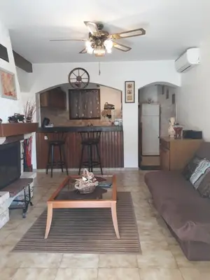 a living room with a couch and a table at Appartement Sole e Mare in Furiani