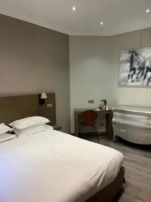 a bedroom with a bed and a bath tub at Chambre Le Chevalblanc