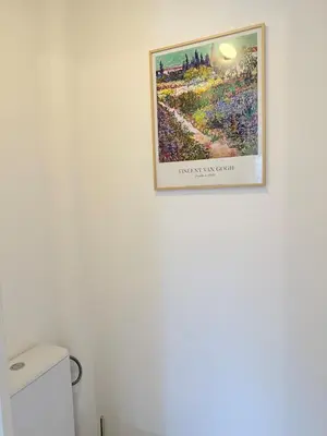 a picture hanging on a wall in a bathroom at Studio neuf avec terrasse centre de Propriano in Propriano