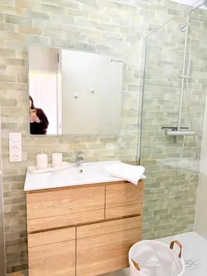 a bathroom with a sink and a mirror at Studio neuf avec terrasse centre de Propriano in Propriano