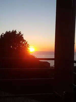 a sunset from the porch of a house at Villa Confina in Villanova