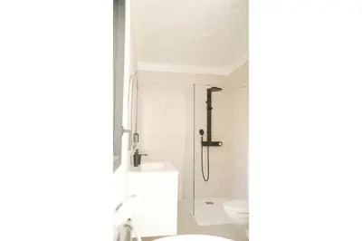 a bathroom with a shower and a toilet at villa la baies des anges in Calcatoggio