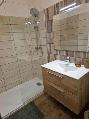 a bathroom with a sink and a shower at Le vieux moulin in Porto-Vecchio