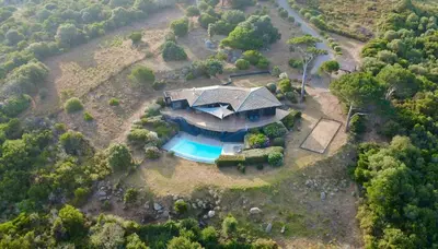 an aerial view of a house with a swimming pool at Villa On One Hectare Facing The Gulf Of Ajaccio in Coti-Chiavari