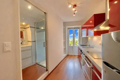 a kitchen with a sink and a refrigerator at Studio centre-ville rue fesch Ajaccio in Ajaccio