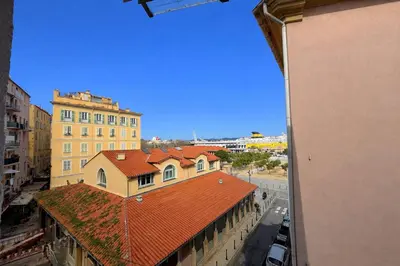a view of a building with a red roof at Studio centre-ville rue fesch Ajaccio in Ajaccio