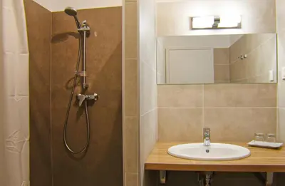 a bathroom with a sink and a shower at le Belvedere in Coti-Chiavari