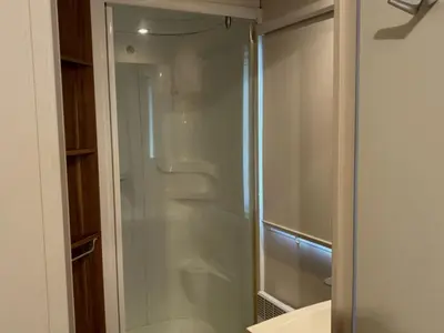 a glass shower in a bathroom with a sink at Mobil Home avec Terrasse, 2 Chambres, 4 Pers. - API-1-52-840 in Vico