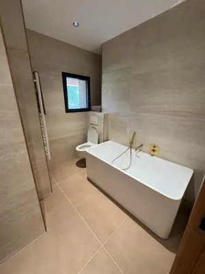 a kitchen with a wooden counter top and a sink at Porto-Vecchio, Villa luxueuse 8 pers, 4 chambres, piscine privée in Porto-Vecchio