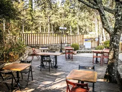 a group of tables and chairs on a patio at Mobil Home 3 Chambres avec Terrasse - Pour 6 Personnes - API-1-52-1659 in Sartène