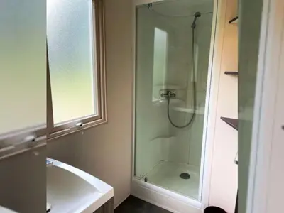 a bathroom with a shower and a bath tub at Mobil-home confortable avec terrasse pour 4 pers. - API-1-52-1661 in Sartène