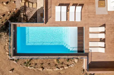 an overhead view of a swimming pool in a house at Villa CASATANGO in Zonza