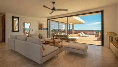 a kitchen with a wooden island with a counter top at Villa CASATANGO in Zonza