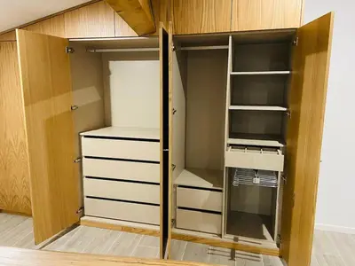 a walk in closet with a door and shelves at Charmante villa dans un petit coin de Paradis in Propriano