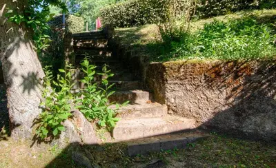 a set of stone stairs in a garden at Casa Lisandru
