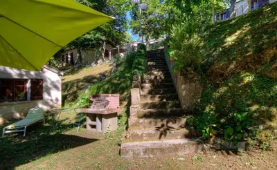 a set of stairs with a bench and a stair case at Casa Lisandru