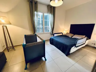 a bedroom with a bed and a window at A Murella - maison de vacances à Oletta en Corse in Oletta