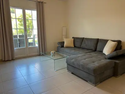 a living room with a couch and a glass table at A Murella - maison de vacances à Oletta en Corse in Oletta