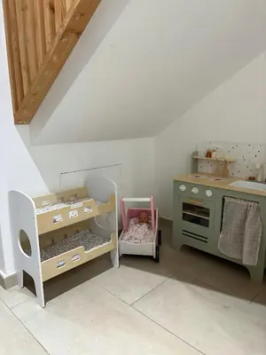 a childs play room with a toy kitchen and a stove at Granite Villa Between Porto-Vecchio And Bonifacio in Figari