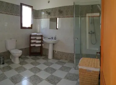 a bathroom with a toilet and a shower and a sink at Maison avec piscine sans voisinage à 4km de la mer in Canale-di-Verde