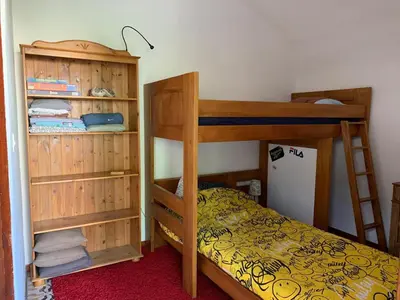 a bedroom with two bunk beds and a ladder at Sartene - Corse du sud ouest in Sartène
