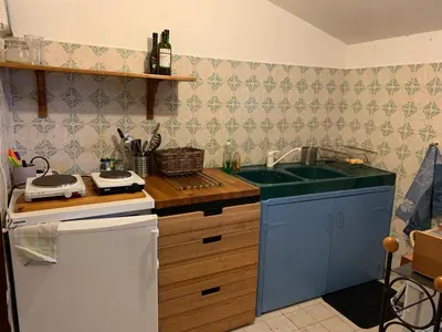 a kitchen with a sink and a counter at Sartene - Corse du sud ouest in Sartène