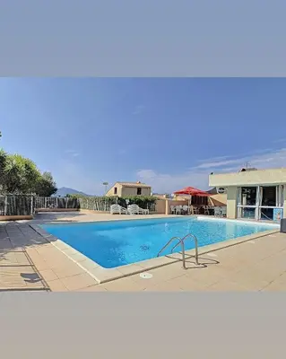 a large swimming pool in a resort at Appartement au cœur de Porticcio in Porticcio
