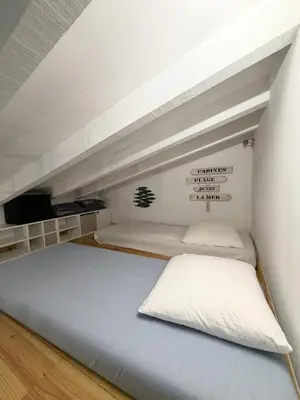 a bedroom with two bunk beds and a tv at Charmant studio au centre de Porticcio in Grosseto-Prugna
