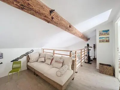 a living room with a couch and a chair at Mini villa Stagnola in Pietrosella