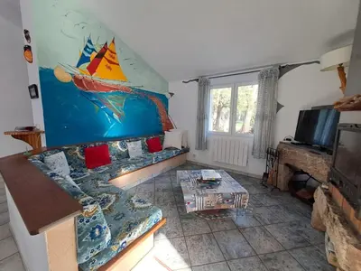 a living room with a couch and a table at Villa Mare E Muntagna in Porto-Vecchio