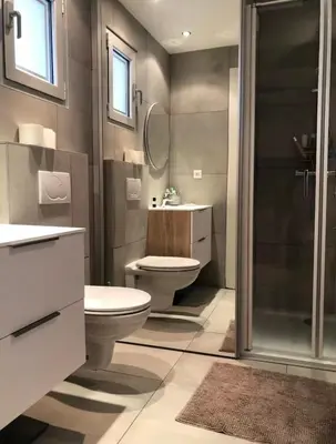 a bathroom with a toilet and a sink and a shower at Santa Giulia, Résidence Cala Sultana Numero 40 in Porto-Vecchio