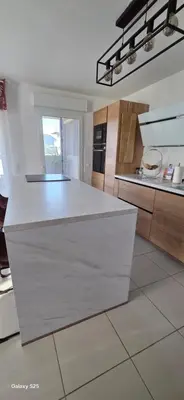 a kitchen with a white counter top in a room at T3 Cosy Ajaccio in Ajaccio
